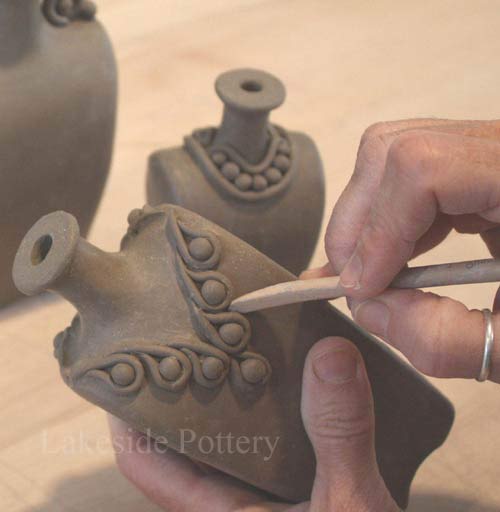 Hand built sculpted clay bottles