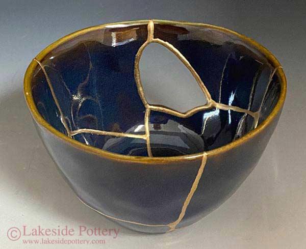 Kintsugi bowl with a missing segment representing finding beauty, rebirth and remembrance even when a loved one is missing.