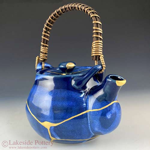 Blue tea pot with kintsugi repair