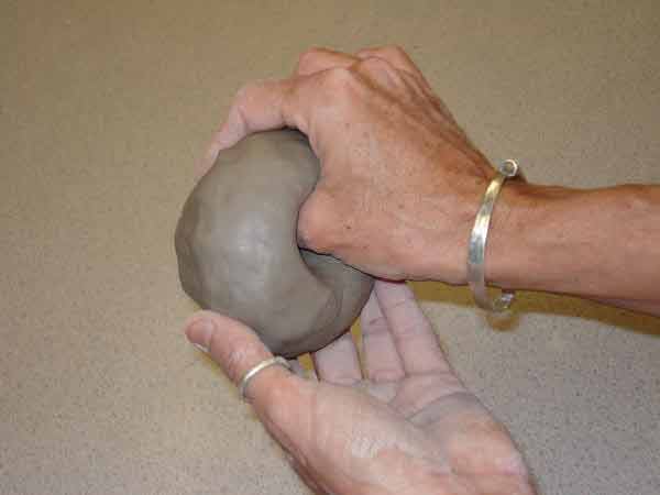 Make a hole in center of clay ball