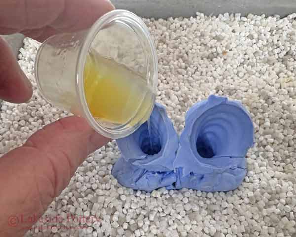 Pouring resin epoxy mix into the mold