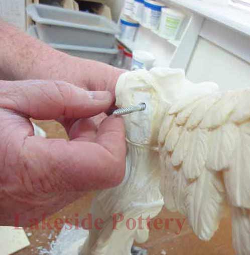 Assembling Statue's wing to body