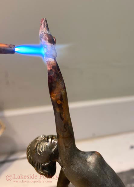 Brazing bronze statue