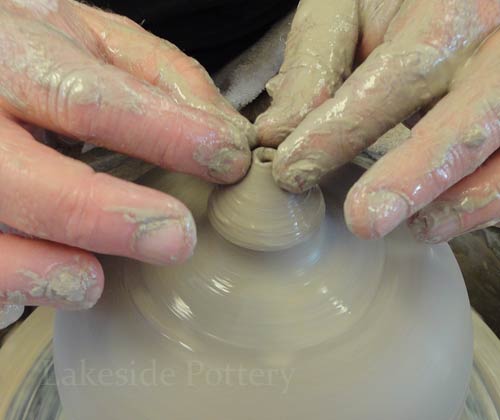 making missing piece on the pottery wheel