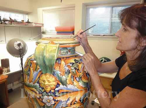 painting the repaired area of antique Italian vase