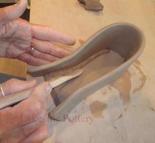 blend the clay coil with wood tool or finger