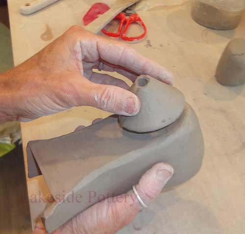 place clay heel and mark for scoring
