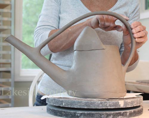 large clay watering cane