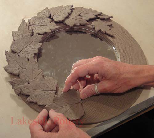 Pressed leaves on mirror frame