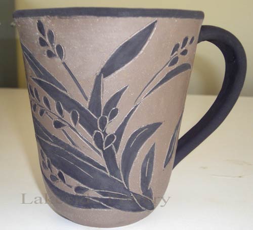finsihed sgraffito on clay mug