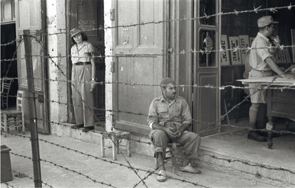 Palestinian resident behind the barbed-wire boundary in Ajami after Jaffa’s conquest in 1948