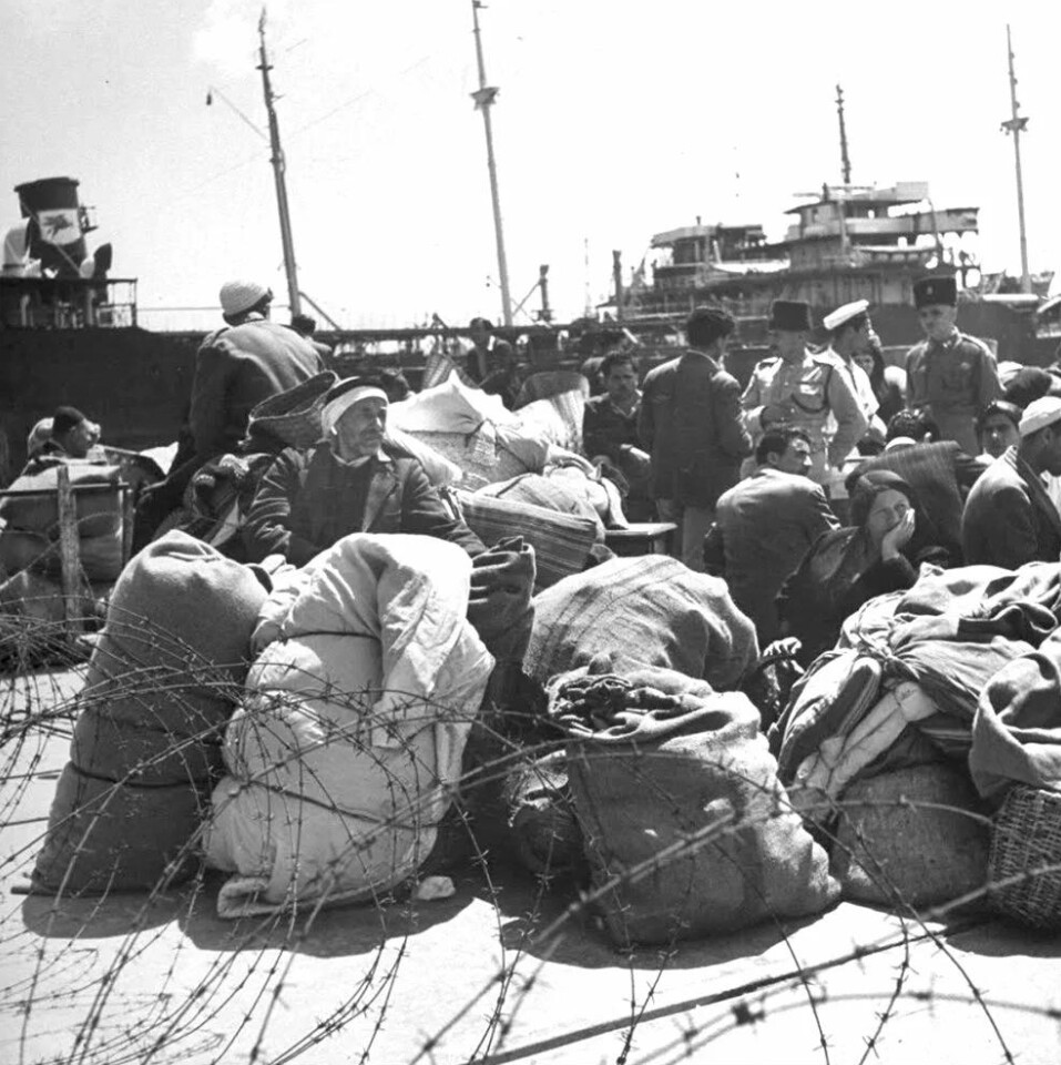 Displaced Palestinian civilians with their belongings during the 1948 war