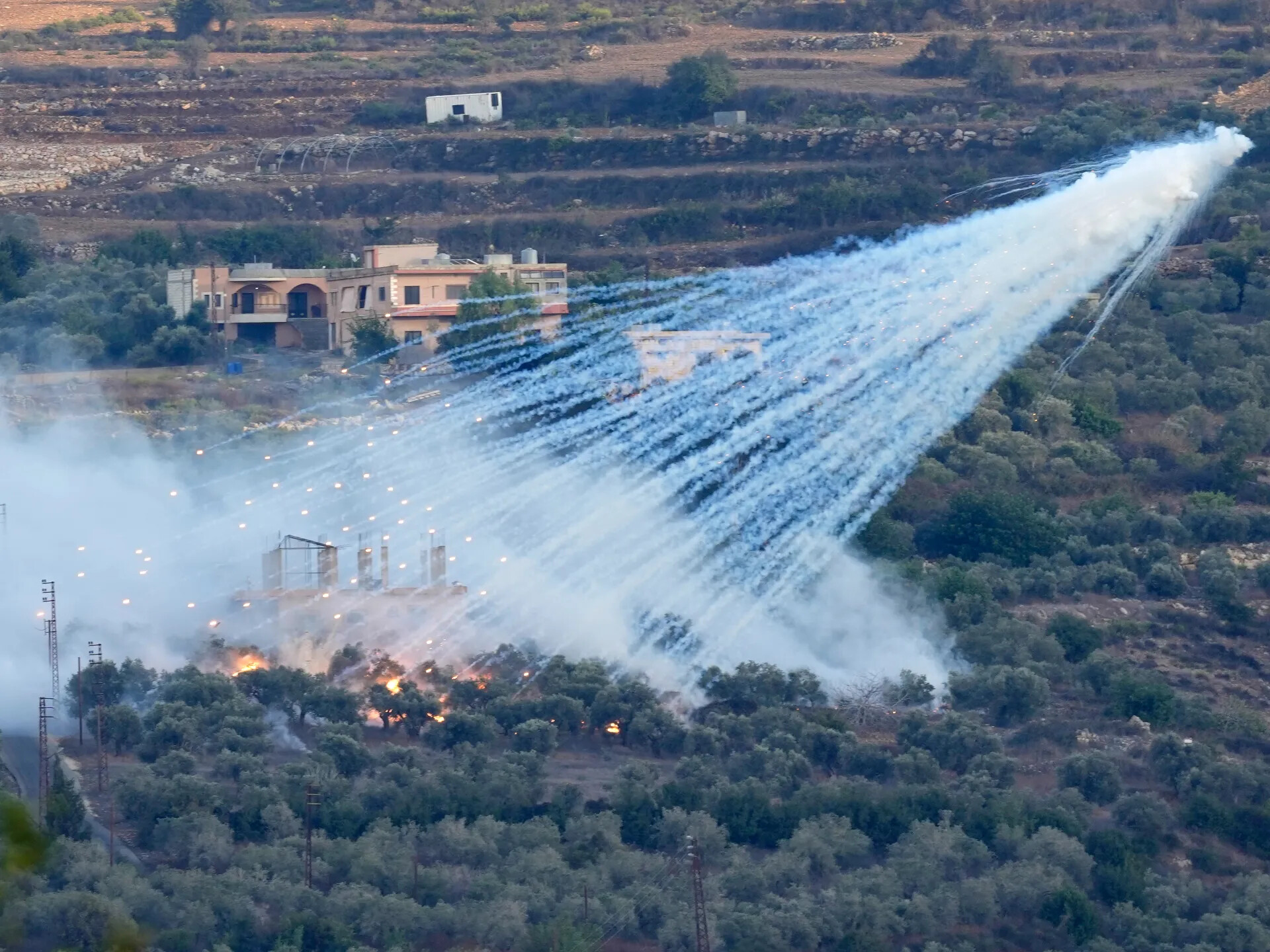 White-phosphorus munitions descending over southern Lebanon