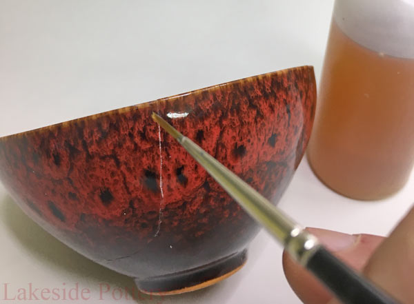 Apply lacquer with thin brush over the repair line in the desired thickness