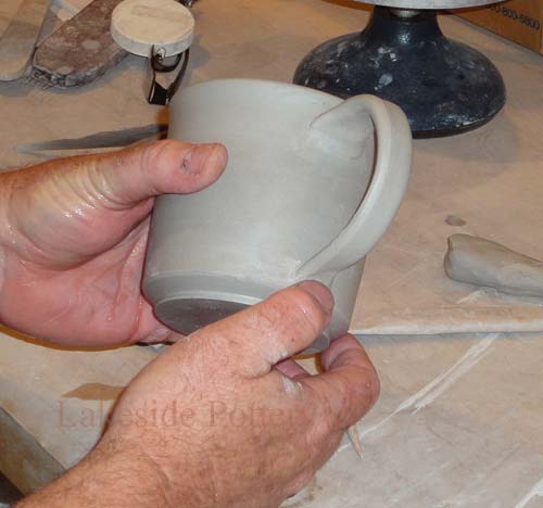 Apply handle to bottom of mug