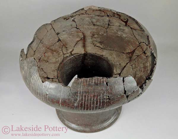 antique clay vessel glued