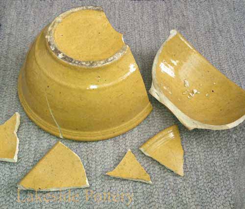 Early american broken stoneware bowl