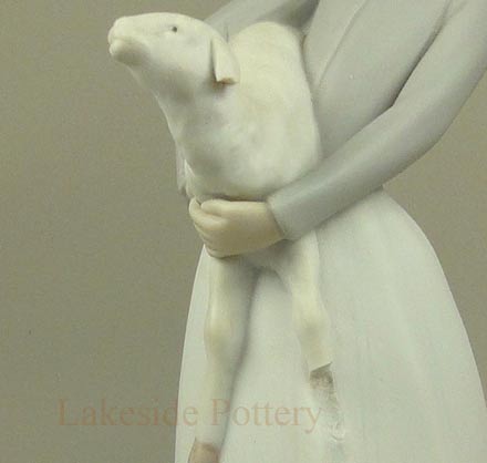 Llardo figurine -- girl with lamp mising leg and ear