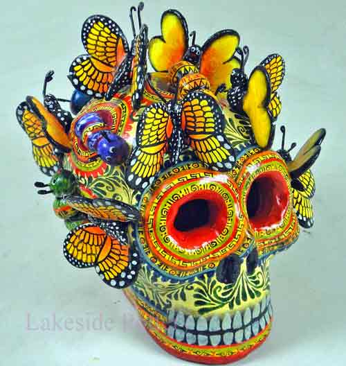 butterflies mexican skull sculpture repaired