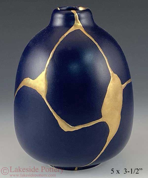 kintsugi - mending broken pottery with golden jointery